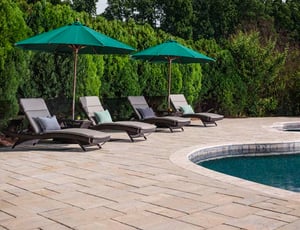 Paver patio around pool by CKC Landscaping